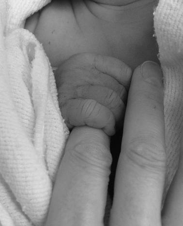 [with mother's hand]